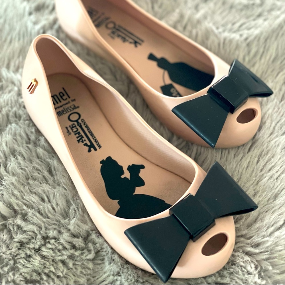 Mel by Melissa “Alice In Wonderland” edition. Light pastel pink, size 12.